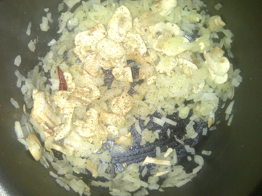 Once the onions are translucent, add your mushrooms and grate in some nutmeg and ginger