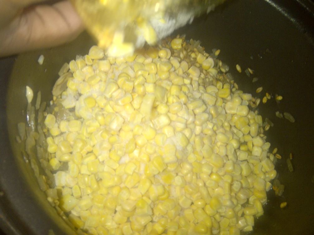Add in your corn then your wine stir frequently till your wine is evaporated